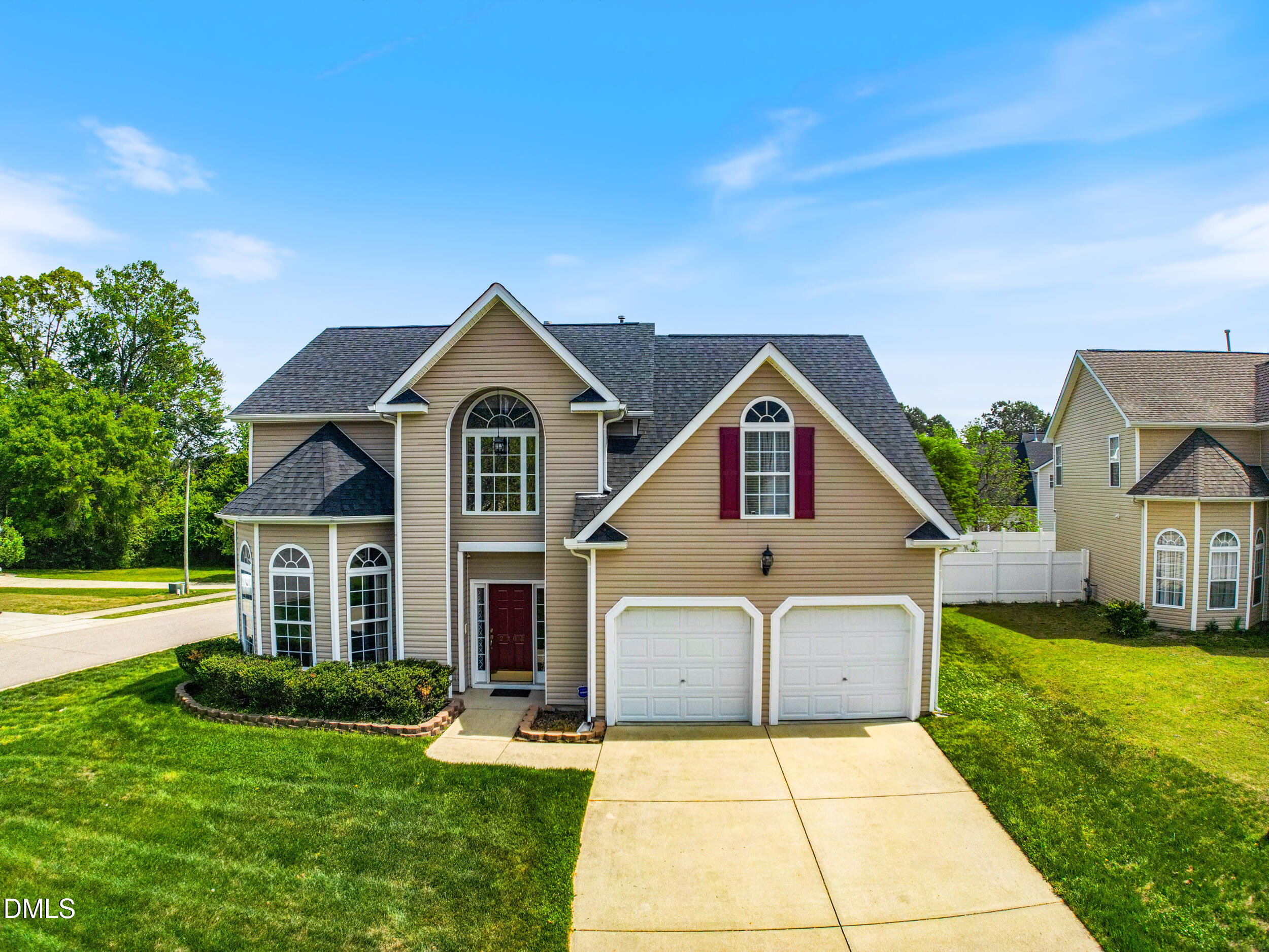 2208 Water Spray Drive Raleigh, NC 27610 - Photo 1 of 28 a front view of a house with garden