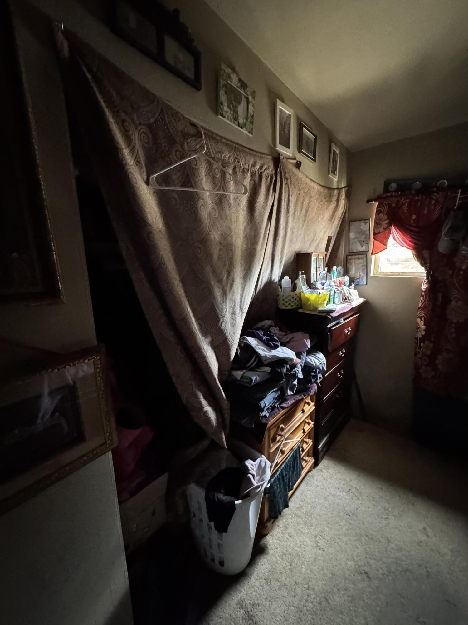 704 North Floral Street Visalia, CA 93291 - Photo 39 of 51 a view of walk in closet with clothes and shoes
