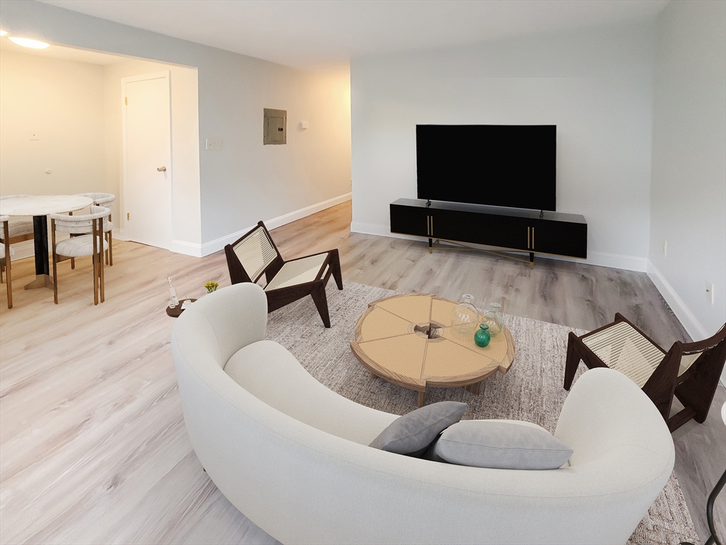 49 Rosedale Street, Unit 1 Boston, MA 02124 - Photo 2 of 8 a living room with furniture and a flat screen tv