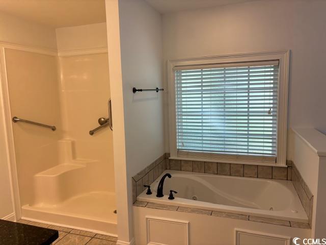2477 Pleasant Grove Road Loris, SC 29569 - Photo 14 of 25 Full bathroom with light tile patterned floors, a shower, and a tub with jets