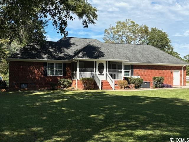 2477 Pleasant Grove Road Loris, SC 29569 - Photo 23 of 25 Ranch-style house with a front lawn, covered porch, and brick siding