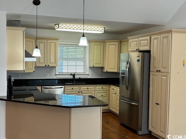 2477 Pleasant Grove Road Loris, SC 29569 - Photo 3 of 25 Kitchen featuring a peninsula, dark stone countertops, stainless steel appliances, hanging light fixtures, and dark wood-type flooring