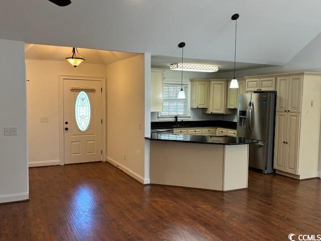 2477 Pleasant Grove Road Loris, SC 29569 - Photo 4 of 25 Kitchen with stainless steel fridge, plenty of natural light, dark wood finished floors, and a peninsula