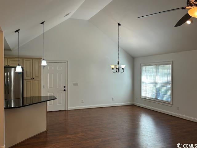 2477 Pleasant Grove Road Loris, SC 29569 - Photo 6 of 25 Unfurnished living room with dark wood-style flooring, high vaulted ceiling, a ceiling fan, and a chandelier