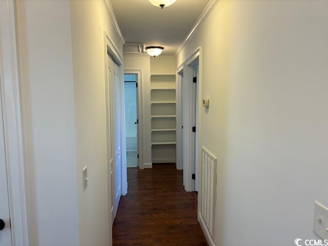 2477 Pleasant Grove Road Loris, SC 29569 - Photo 7 of 25 Corridor with dark wood finished floors and crown molding