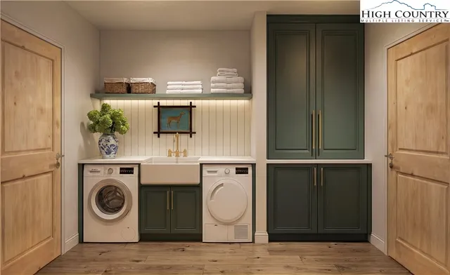 a utility room with mirror washer and dryer