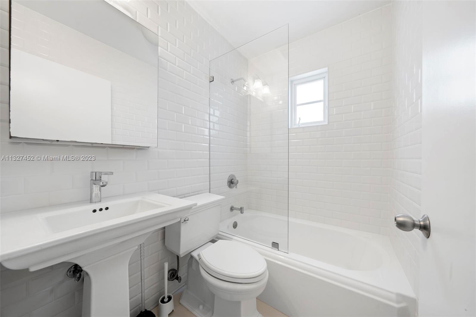 Bayside Miami, FL 33138 - Photo 5 of 9 a bathroom with a sink a toilet and a bathtub