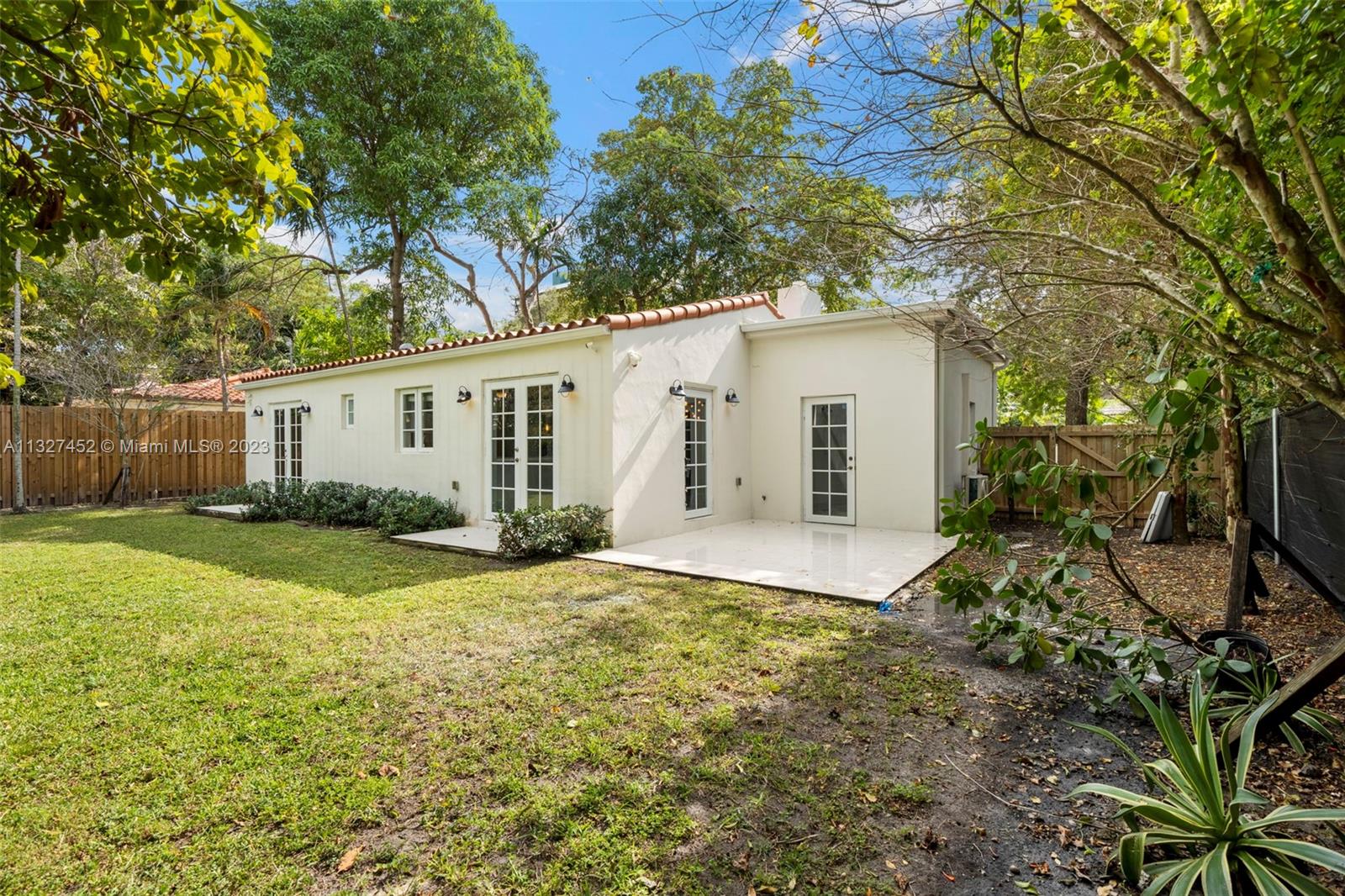 Bayside Miami, FL 33138 - Photo 7 of 9 a view of a house with backyard and a tree