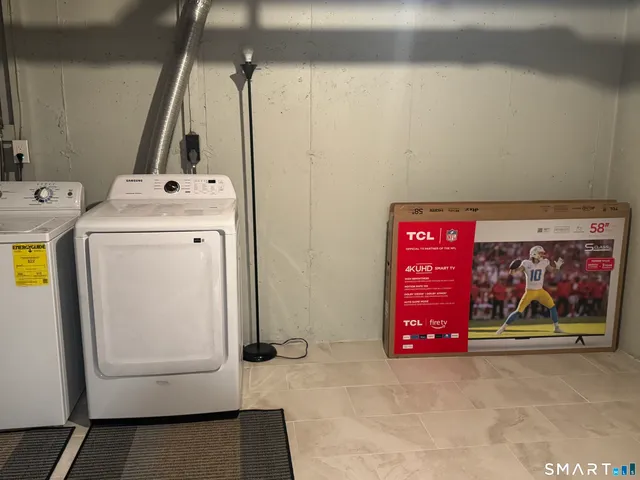 a utility room with dryer and washer