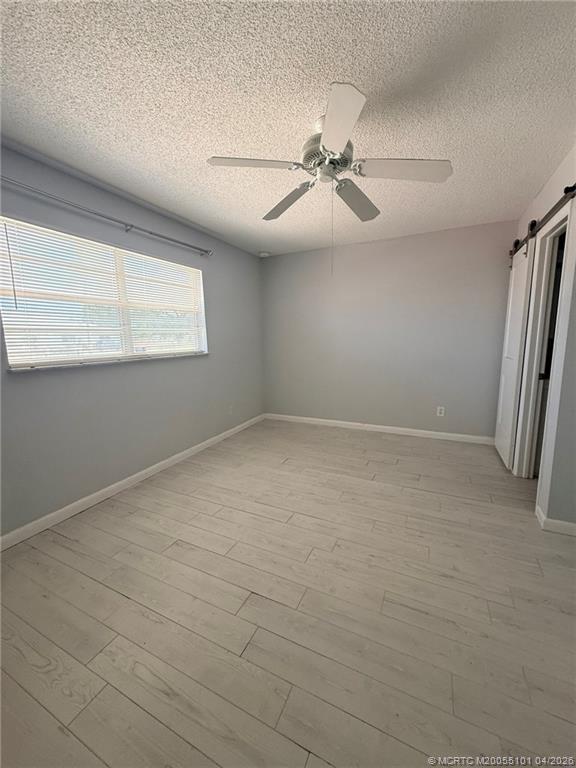 2124 Southeast Edler Drive Stuart, FL 34994 - Photo 9 of 16 an empty room with windows and fan view
