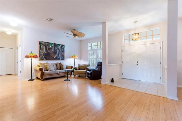 a living room with furniture and a large window