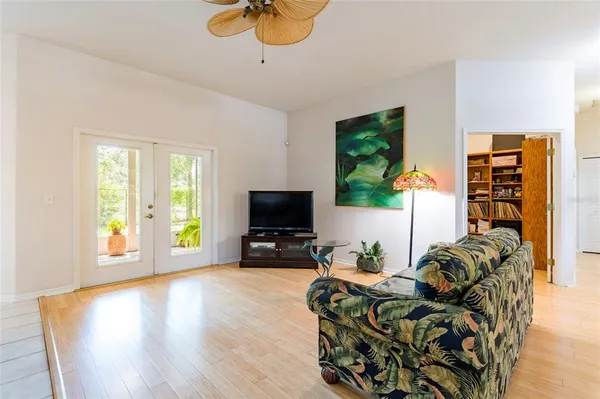 a kitchen with stainless steel appliances granite countertop a stove a sink a microwave a dining table and chairs