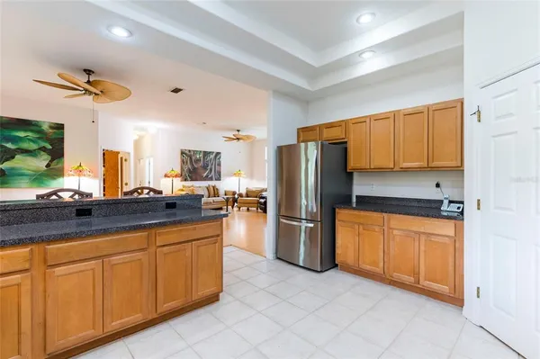 a view of a dining room kitchen with furniture and a kitchen view
