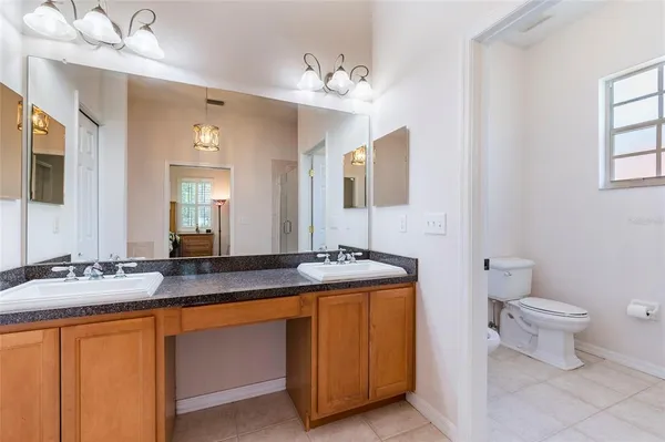 a bed room with a bed and a chair