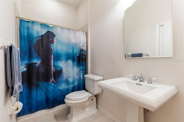 a very nice looking room with a large window and sitting area