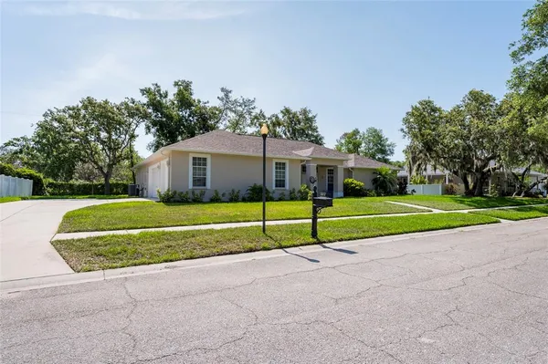 an aerial view of residential building and lake