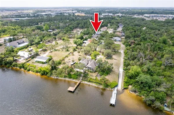 a view of house with a yard