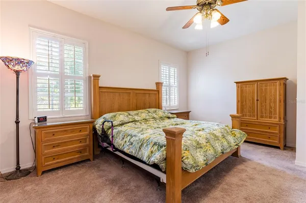 a bathroom with a granite countertop sink mirror and a bathtub