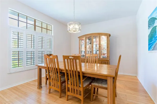 a view of a dining room with furniture and wooden floor