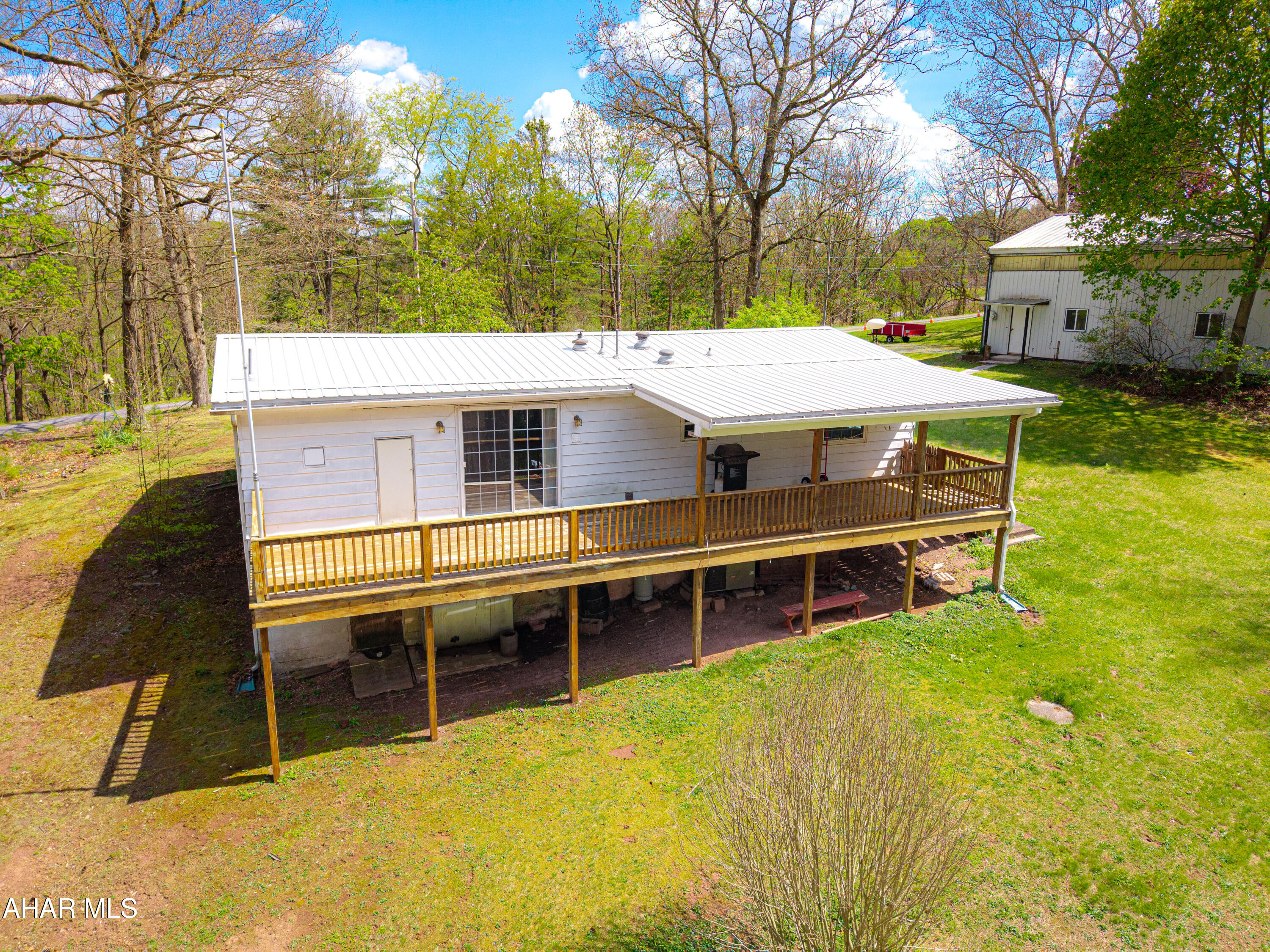 151 Pine Echo Road Everett, PA 15537 - Photo 2 of 51 a view of a house with a swimming pool