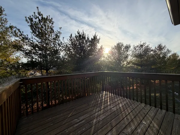 a balcony with wooden floor