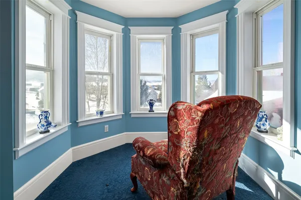 a living room with furniture and windows