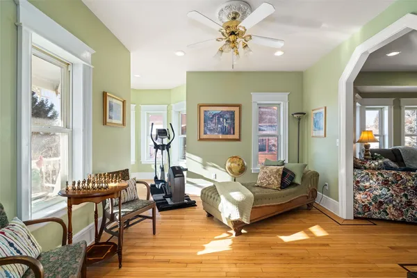 a living room with furniture and wooden floor