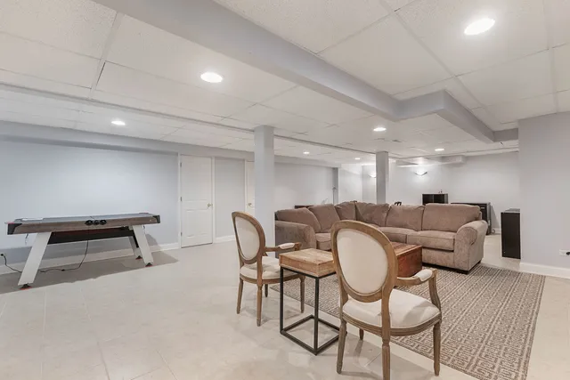 a living room with furniture and a rug