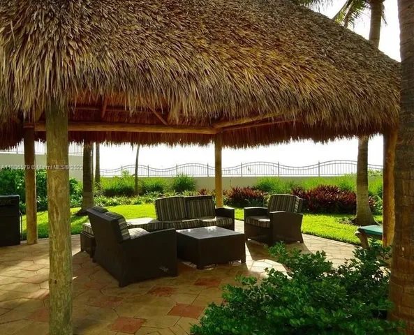 a view of swimming pool with outdoor seating