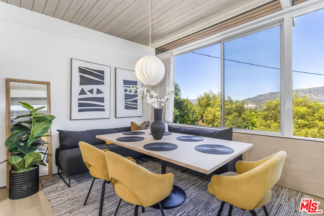 8554 Day Street Sunland, CA 91040 - Photo 11 of 34 a view of a dining room with furniture window and wooden floor