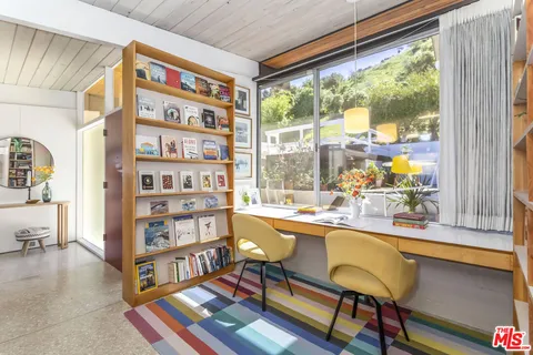 a living room with furniture and a table
