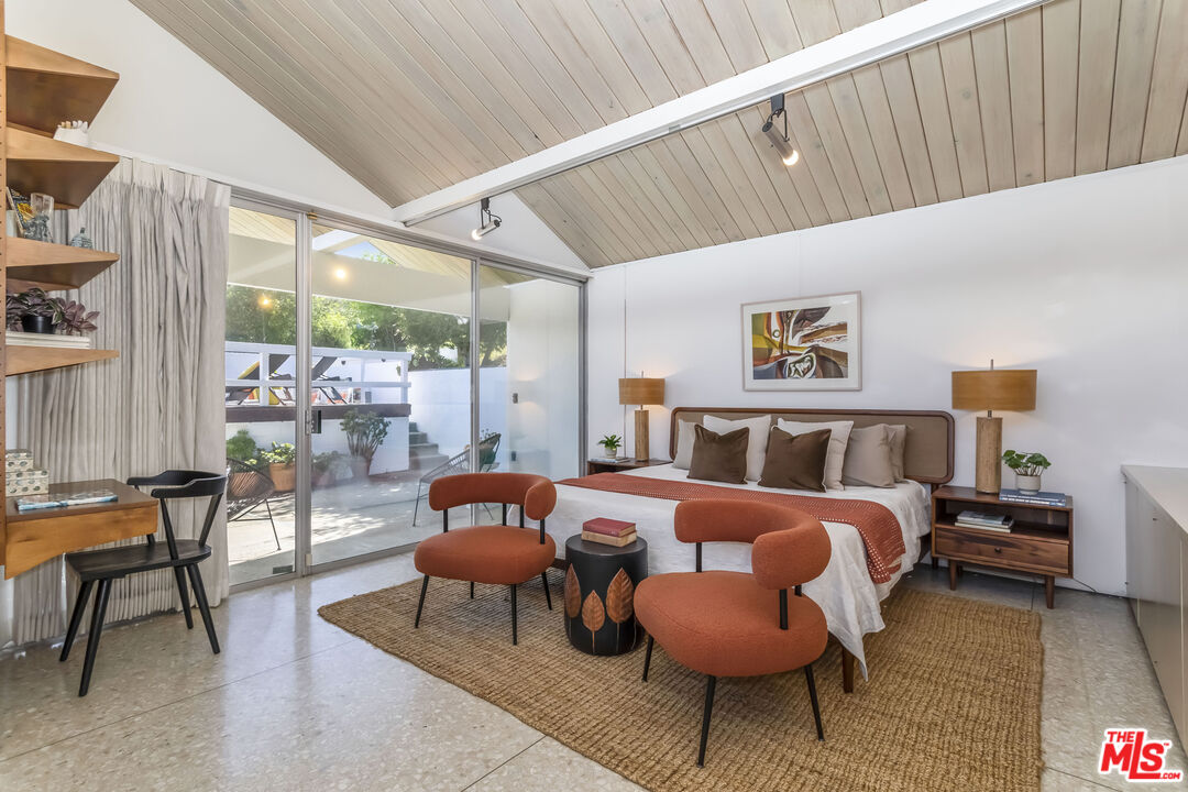 8554 Day Street Sunland, CA 91040 - Photo 15 of 34 a bedroom with furniture and a large window