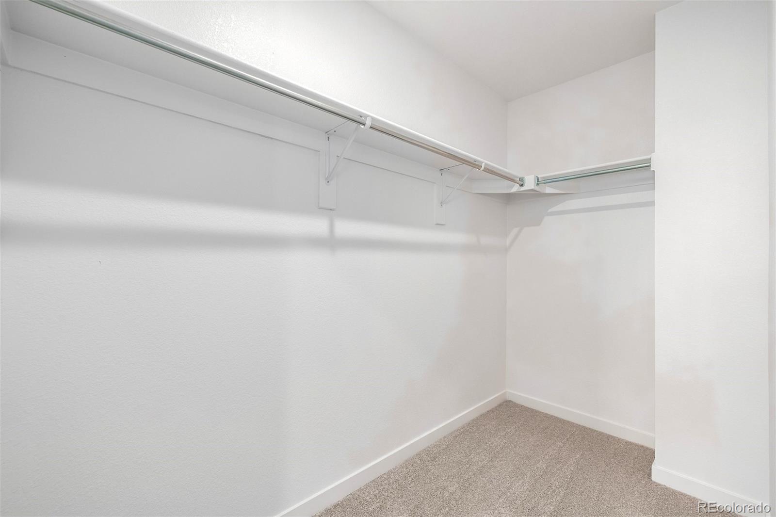 2076 South Holly Street, Unit 2 Denver, CO 80222 - Photo 12 of 24 a view of an empty walk in closet