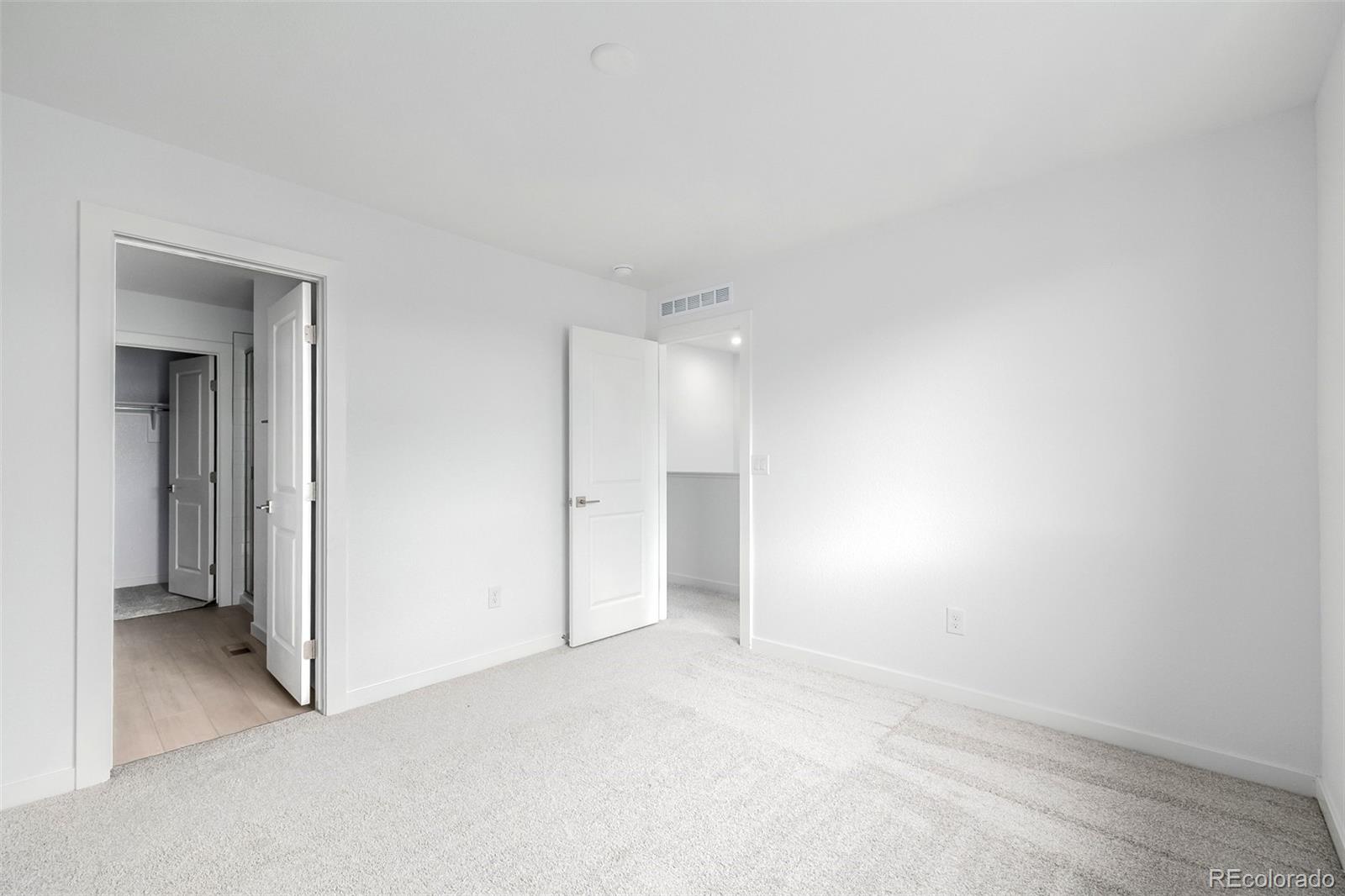 2076 South Holly Street, Unit 2 Denver, CO 80222 - Photo 18 of 24 a view of an empty room and closet area