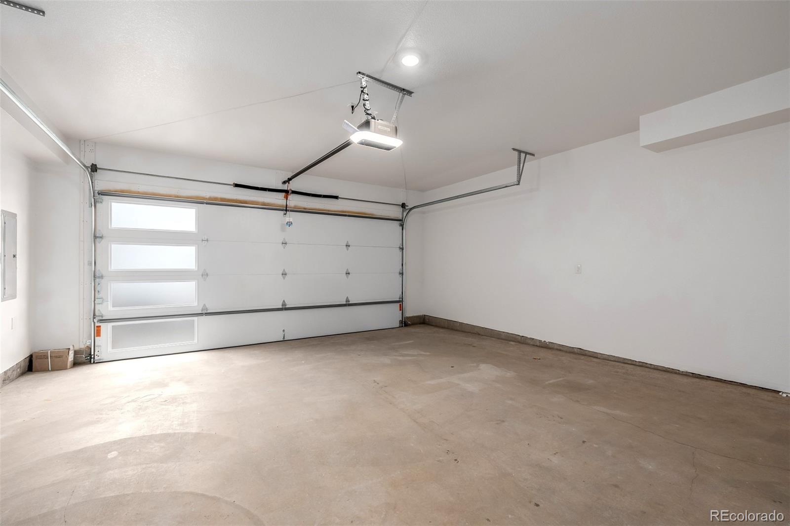 2076 South Holly Street, Unit 2 Denver, CO 80222 - Photo 19 of 24 an empty room with windows