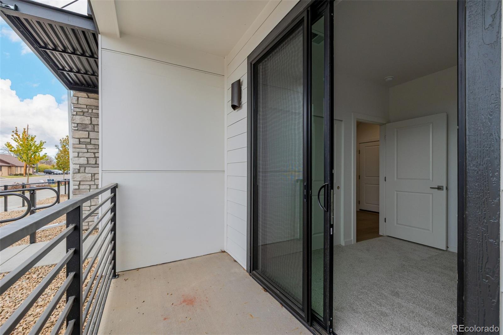 2076 South Holly Street, Unit 2 Denver, CO 80222 - Photo 20 of 24 a view of entryway with wooden floor