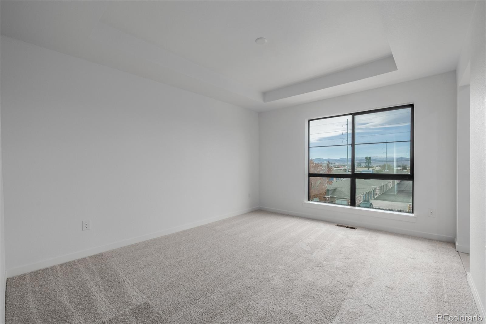 2076 South Holly Street, Unit 2 Denver, CO 80222 - Photo 8 of 24 an empty room with a window