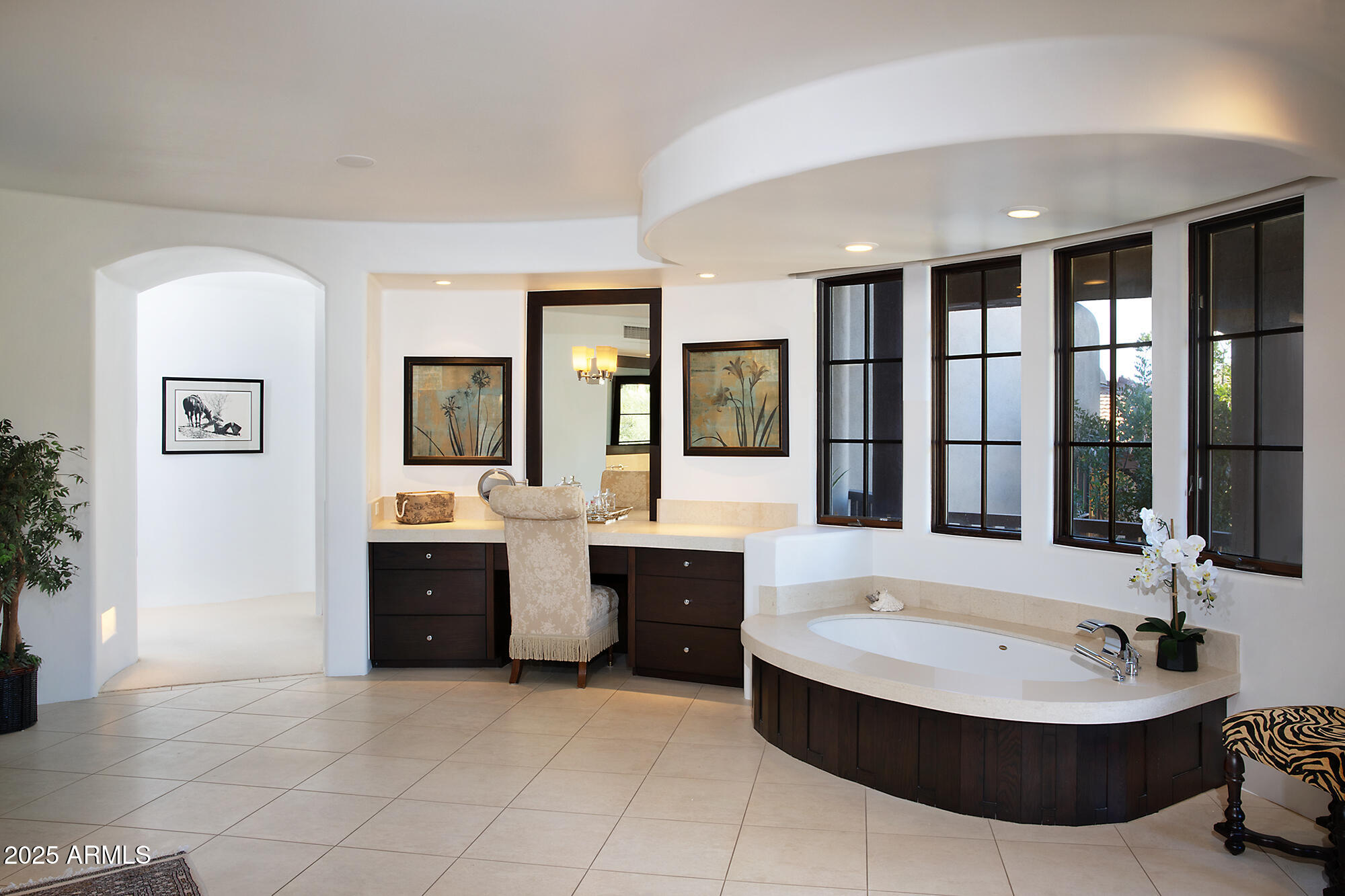 10040 East Happy Valley Road, Unit 784 Scottsdale, AZ 85255 - Photo 25 of 47 a spacious bathroom with a tub sink and mirror