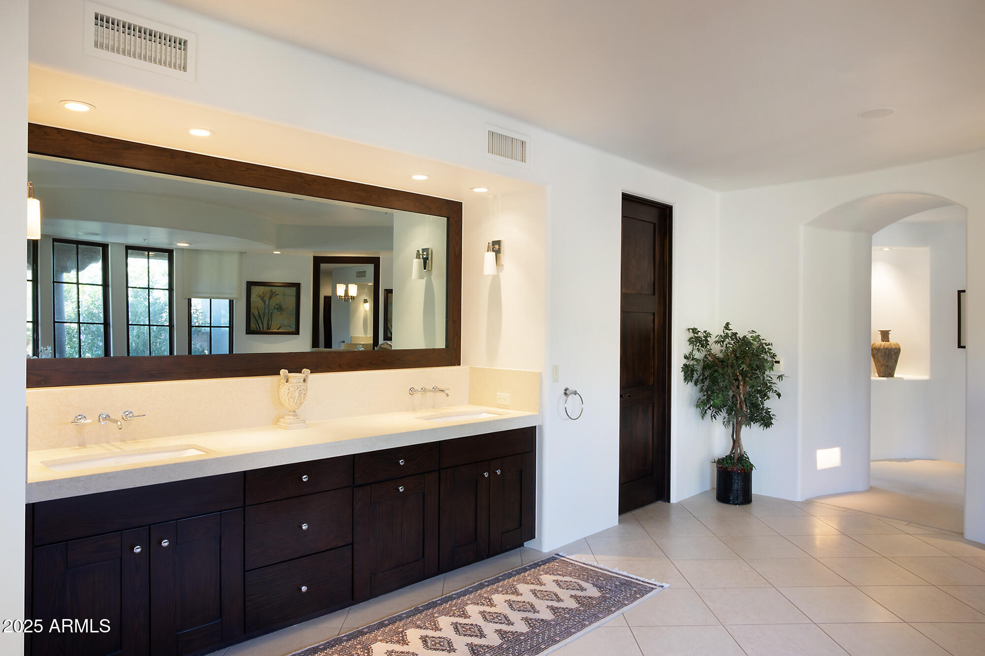 10040 East Happy Valley Road, Unit 784 Scottsdale, AZ 85255 - Photo 26 of 47 a spacious bathroom with a sink and a mirror