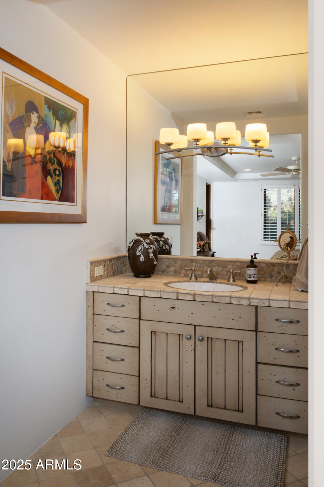 10040 East Happy Valley Road, Unit 784 Scottsdale, AZ 85255 - Photo 32 of 47 a bathroom with a double vanity sink and a mirror