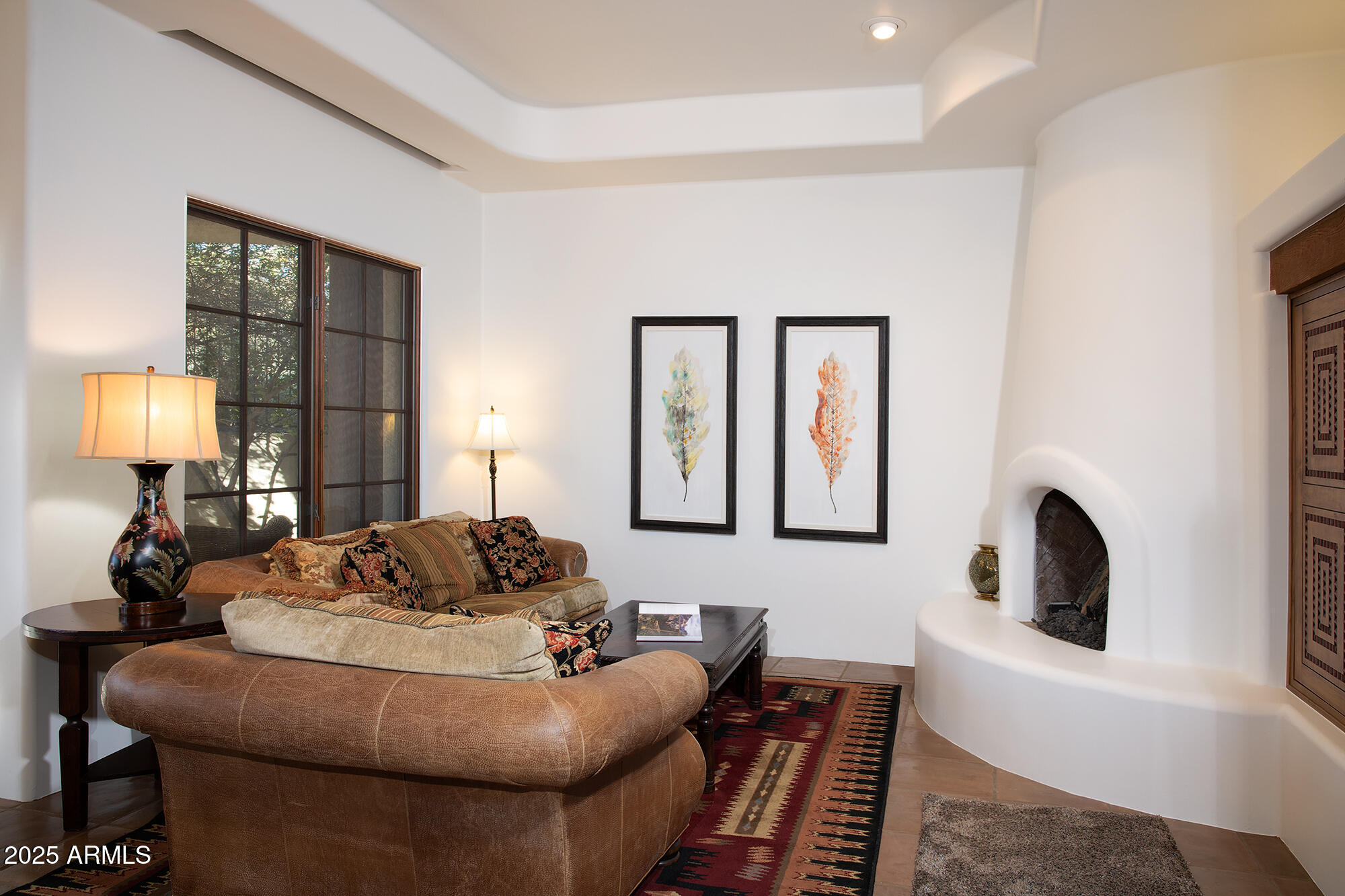10040 East Happy Valley Road, Unit 784 Scottsdale, AZ 85255 - Photo 39 of 47 a living room with furniture and a lamp