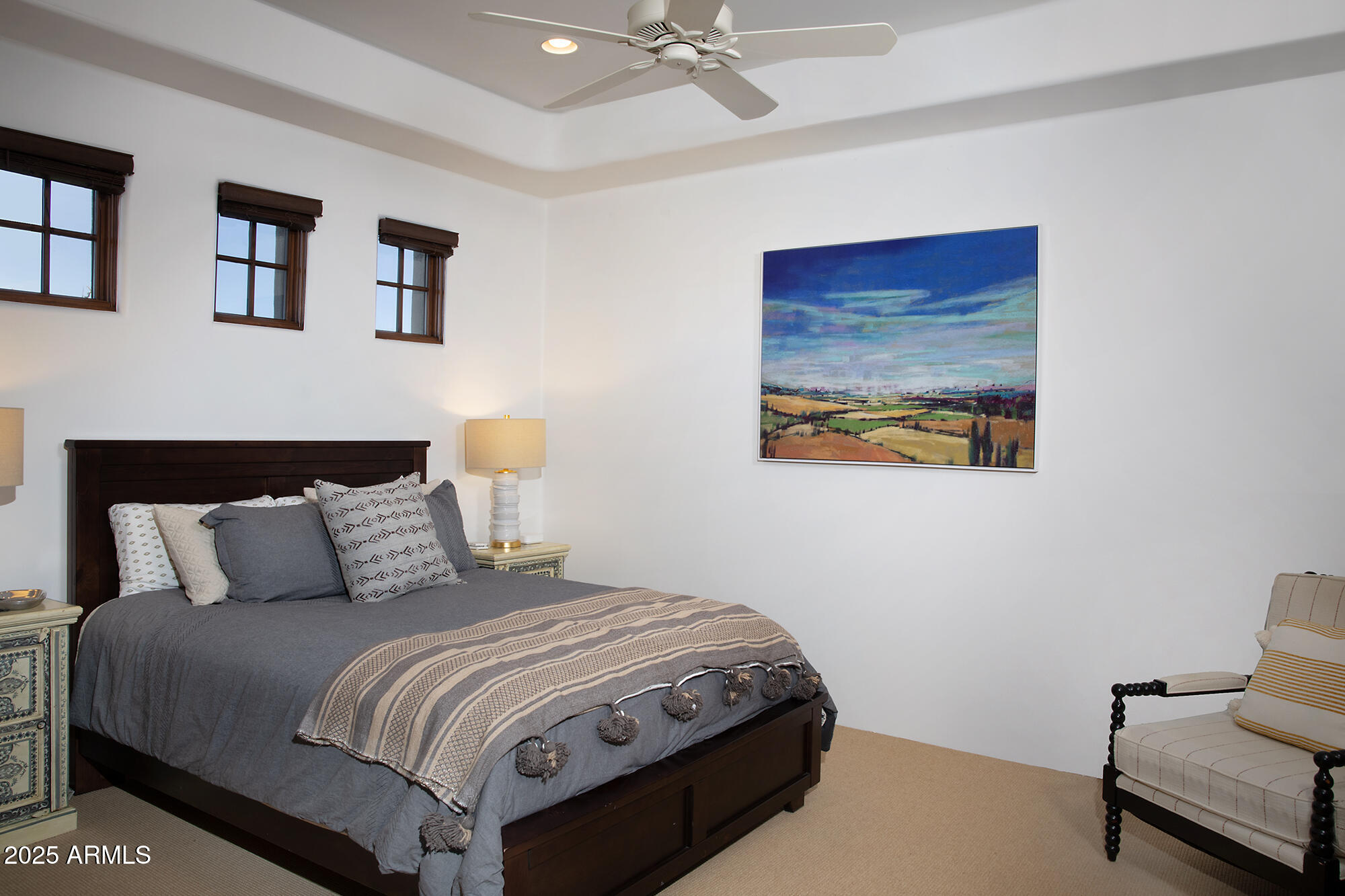 10040 East Happy Valley Road, Unit 784 Scottsdale, AZ 85255 - Photo 42 of 47 a bedroom with a bed and painting on the wall