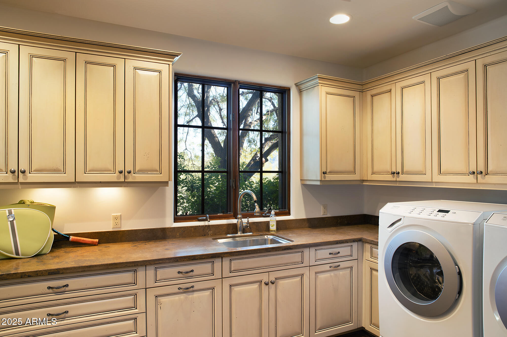 10040 East Happy Valley Road, Unit 784 Scottsdale, AZ 85255 - Photo 44 of 47 a kitchen with a sink and a window