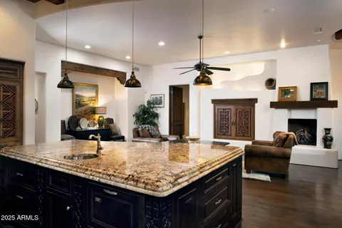 a living room with furniture and a lamp