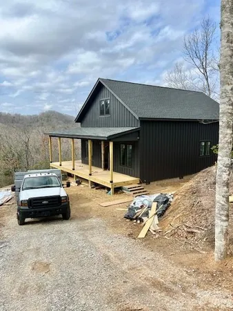 a front view of a house with parking space