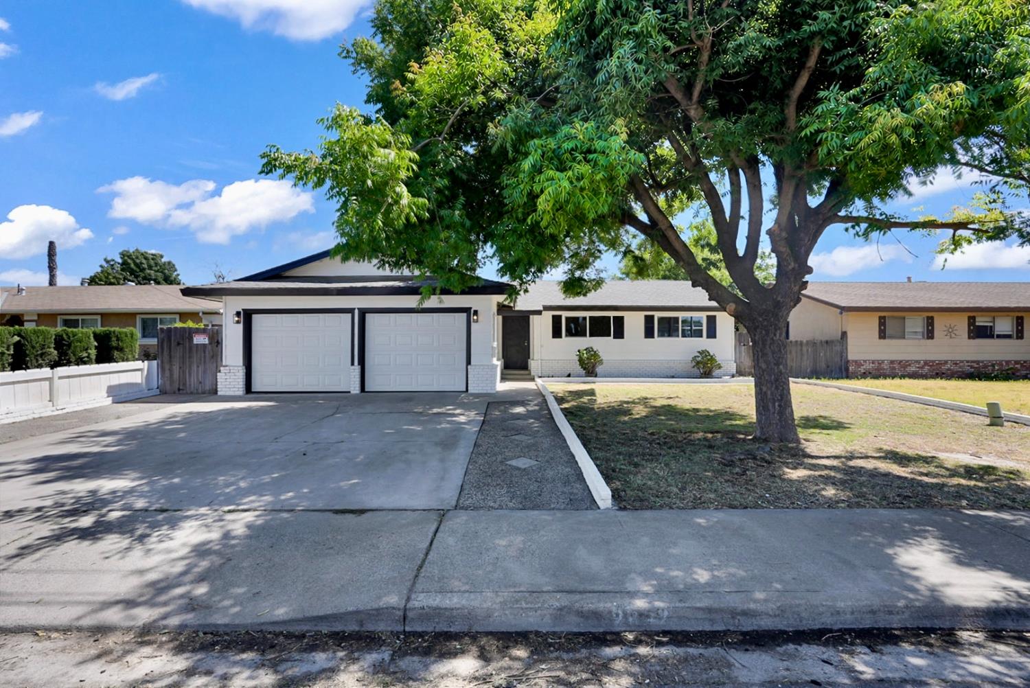 2832 Fowler Road Ceres, CA 95307 - Photo 23 of 28 a front view of a house with garden