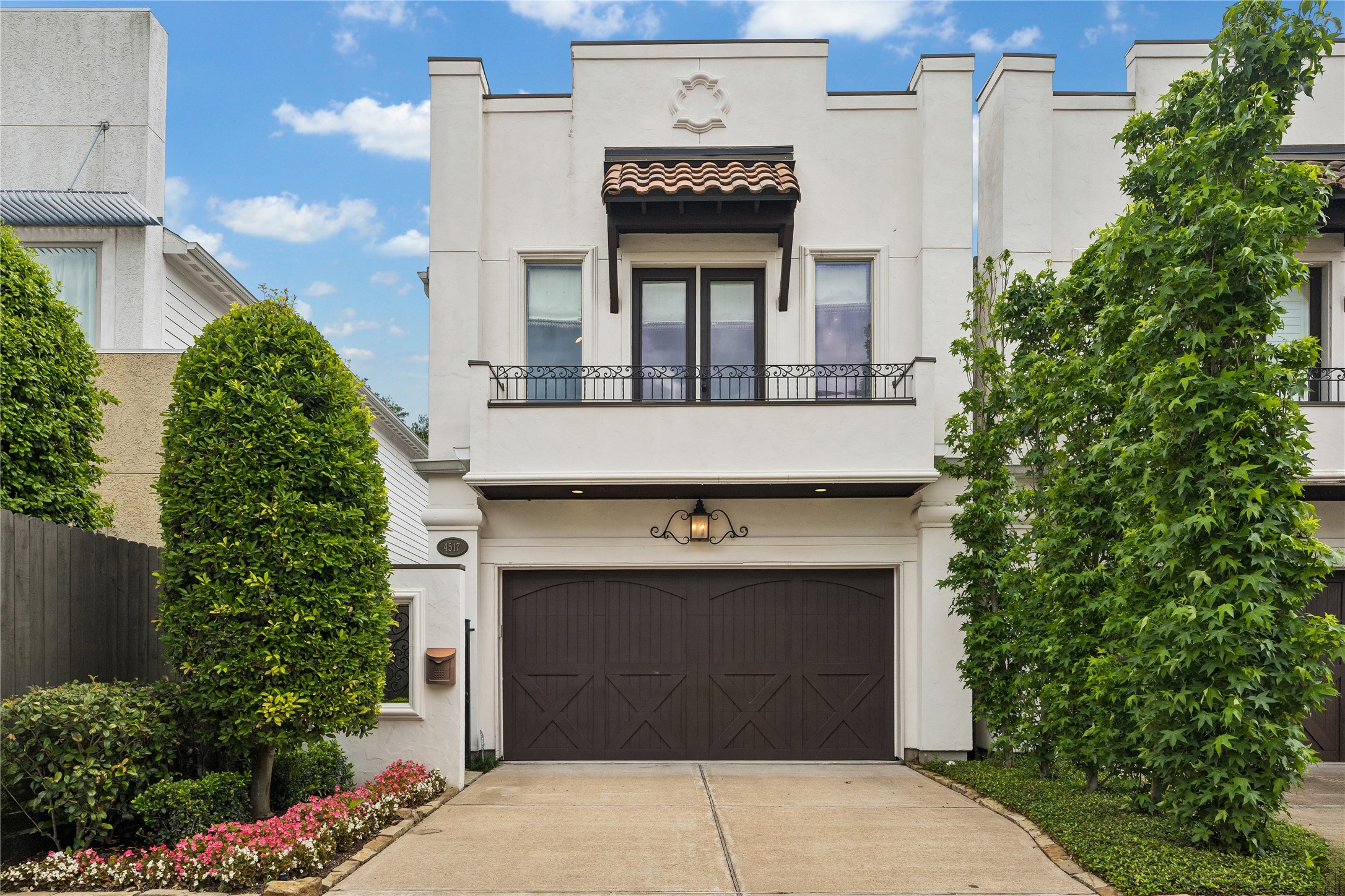 Sophisticated Rice Military single family home, with first floor living, beautifully landscaped front yard and elegant Mediterranean-style facade