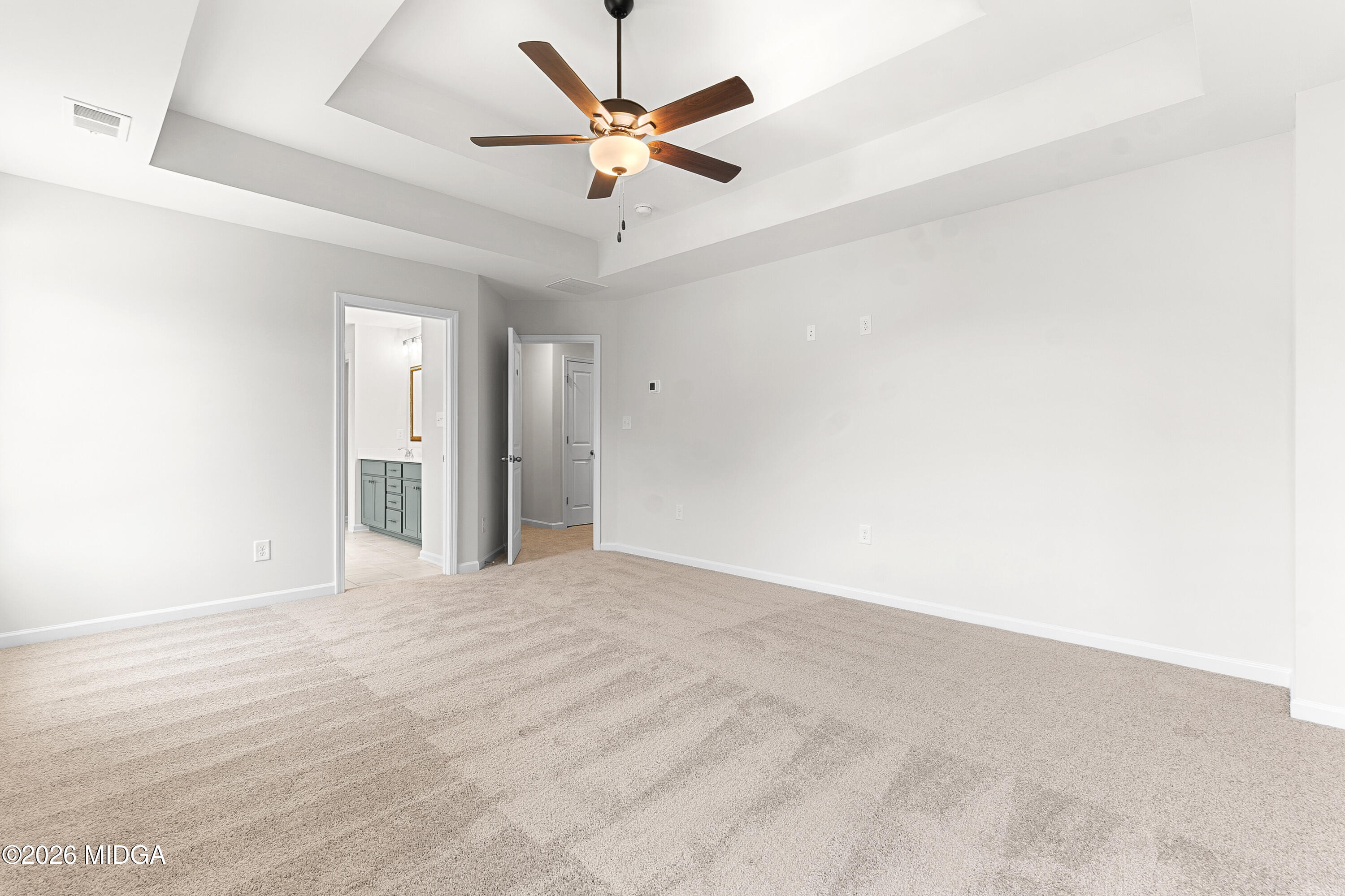 5393 Felles Way, Unit 359 Forsyth, GA 31029 - Photo 29 of 54 an empty room with ceiling fan and window