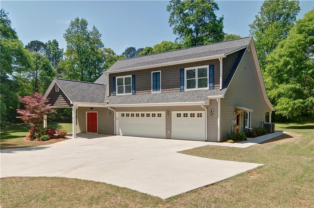 5800 Villa Rica Highway Dallas, GA 30157 - Photo 1 of 37 a front view of a house with a garage