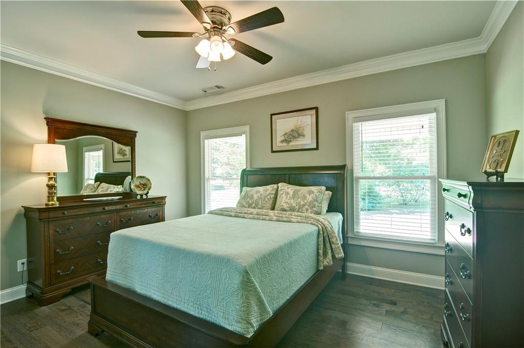 5800 Villa Rica Highway Dallas, GA 30157 - Photo 21 of 37 a bedroom with a bed and a chandelier
